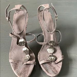 Light gray snakeskin sandals with silver hardware.